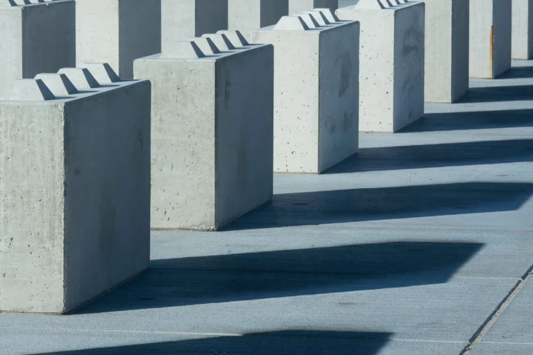 Concrete blocks casting long shadows, creating an urban and abstract pattern.
