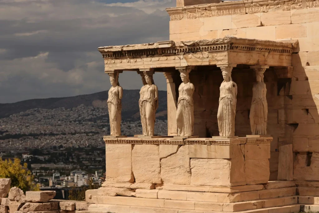 View of the iconic Caryatids at the Erechtheion, part of the Acropolis complex in Athens, Greece.
