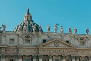 Stunning view of St. Peter's Basilica in Vatican City, highlighting its classic architecture and intricate statues.
