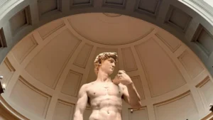 Low angle view of Michelangelo's David sculpture in Florence museum dome.