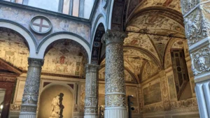 Renaissance architecture and frescoes in the courtyard of Palazzo Vecchio, Florence, Italy, showcasing exquisite details.