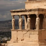 View of the iconic Caryatids at the Erechtheion, part of the Acropolis complex in Athens, Greece.