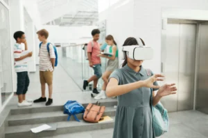 Group of students exploring virtual reality technology at a modern school setting.