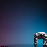 A close-up of a futuristic robot toy on a reflective surface against a gradient background.