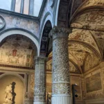 Renaissance architecture and frescoes in the courtyard of Palazzo Vecchio, Florence, Italy, showcasing exquisite details.