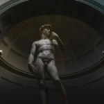 Low-angle shot of Michelangelo's David in Florence's Accademia Gallery.