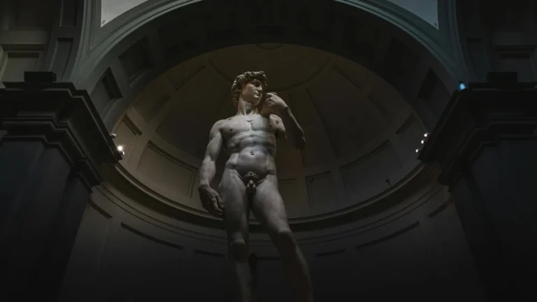 Low-angle shot of Michelangelo's David in Florence's Accademia Gallery.