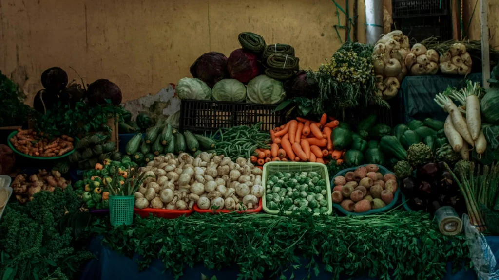 Colorful assortment of fresh vegetables displayed at an outdoor market in Heroica Puebla de Zaragoza, Mexico.