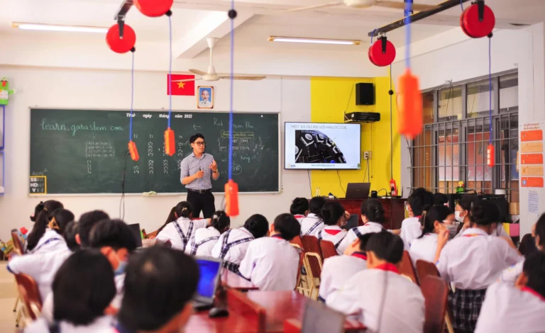 Teacher conducts an interactive lesson in a vibrant classroom setting with attentive students.