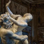 Intricate marble sculpture by Bernini in Rome, capturing mythology and artistry.