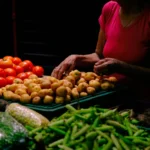 Colorful display of fresh vegetables at a market in Ibagué, Colombia, showcasing local produce.