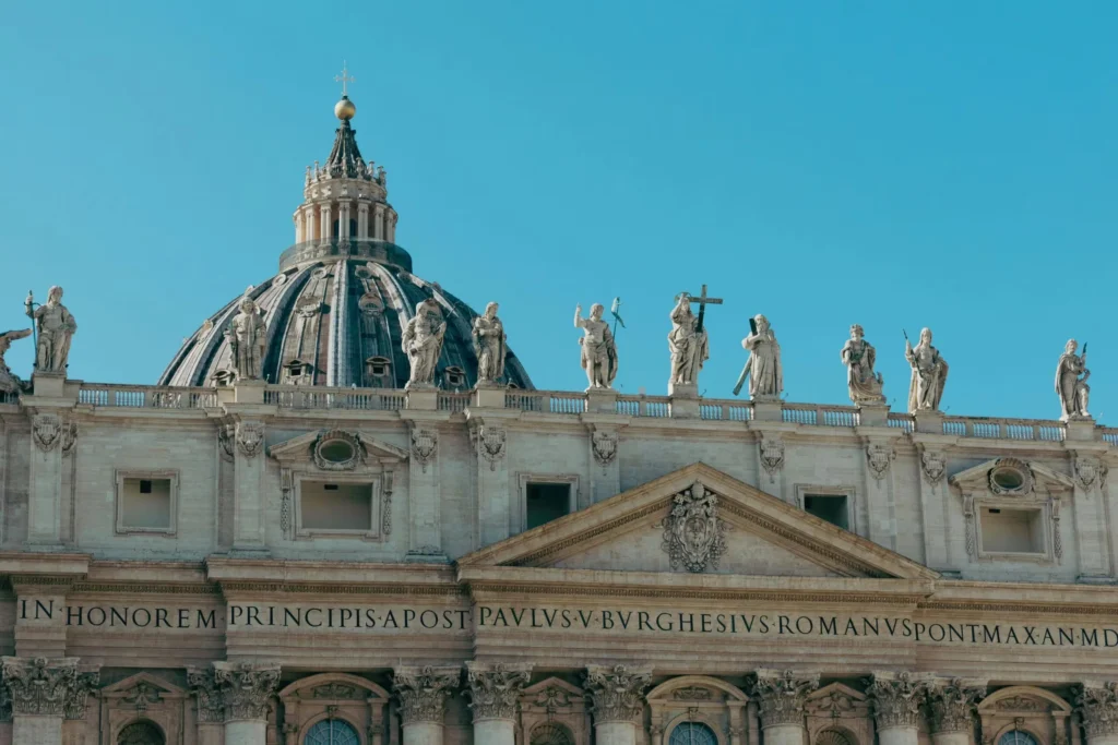 Stunning view of St. Peter's Basilica in Vatican City, highlighting its classic architecture and intricate statues.