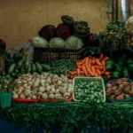 Colorful assortment of fresh vegetables displayed at an outdoor market in Heroica Puebla de Zaragoza, Mexico.