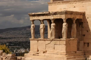 View of the iconic Caryatids at the Erechtheion, part of the Acropolis complex in Athens, Greece.