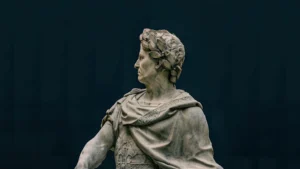 Close-up of a marble statue depicting a classical historical figure with intricate details.